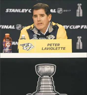  ?? George Walker/The Tennessean ?? Nashville coach Peter Laviolette talked about Game 1 Tuesday at a news conference and looked ahead to Game 2 Wednesday night at PPG Paints Arena.