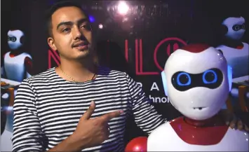  ??  ?? Engineer and CEO of Paaila Technology Binay Raut talks with AFP as he stands beside a robot waiter during an interview in Kathmandu.