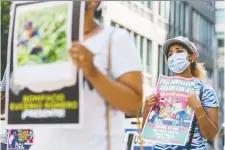  ?? CHRISTOPHE­R KaTSAROV/ THE CANADIAN PRESS ?? Canada aims to increase the number of new permanent residents to 401,000 next year. Protesters draw attention to migrant worker rights in August in Toronto.