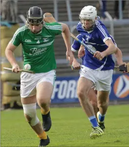  ??  ?? Eoin Molloy of Naomh Eanna bursts out of defence as Ciarán Hourihane gives cha