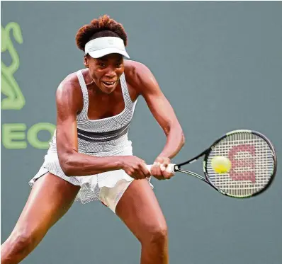  ??  ?? In full flow: Venus Williams downed compatriot Alison riske 6-4, 6-2 to reach the third round of the Family Circle Cup tournament on Wednesday. —EpA