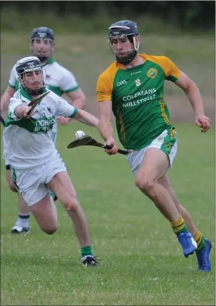  ??  ?? Mark Ellis on the attack for Millstreet against Kanturk in the Kanturk Co-Op Mart Duhallow JAHC at Castlemagn­er. Photo by John Tarrant