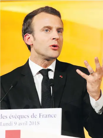  ?? LUDOVIC MARIN, POOL VIA AP ?? French President Emmanuel Macron vowed to continue with his controvers­ial train reforms despite public anger. The measure is part of his economic plan, which critics say is favouring the rich.
