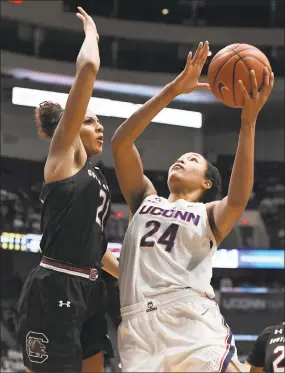  ?? Jessica Hill / Associated Press ?? UConn’s Napheesa Collier, right, shoots over South Carolina’s Mikiah Herbert Harrigan during the second half on Monday.