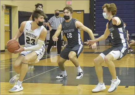  ?? PETE BANNAN — MEDIANEWS GROUP ?? West Chester Rustin’s Griffin Barrouk (23) keeps the ball from Great Valley’s Michael Corrigan (12) and Matt Wellener (2) in the final seconds as the Golden Knights went on to 62-55victory.