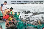  ??  ?? Twice lucky: Rupasinghe Jayasinghe with his family and his battered boat