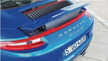  ??  ?? Rear spoiler automatica­lly lif ts up and retracts at certain speeds.