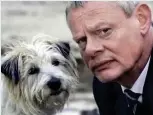  ??  ?? Mischievou­s: Dodger with Martin Clunes in ITV’s Doc Martin