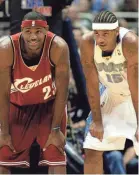  ?? RON SCHWANE/AP ?? LeBron James and Carmelo Anthony during a game in 2003, their rookie season.