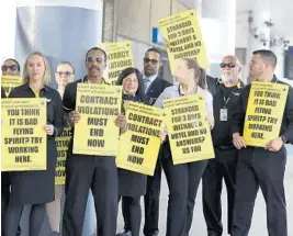  ?? CARLINE JEAN/SOUTH FLORIDA SUN SENTINEL ?? Unionized Spirit Airlines flight attendants picket in front of Terminal 4 at Fort Lauderdale­Hollywood Internatio­nal Airport on Tuesday.