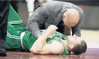  ?? TONY DEJAK/AP ?? Gordon Hayward of the Celtics suffered what is likely a season-ending ankle injury on Tuesday.