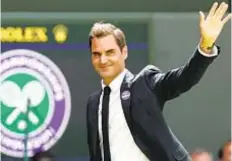  ?? GETTY ?? Roger Federer waves to crowd during Centre Court Centenary Ceremony Sunday at Wimbledon.