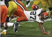  ?? DON WRIGHT — THE ASSOCIATED PRESS ?? Browns running back Kareem Hunt (27) is tackled during the second half of an NFL wild-card playoff game against the Pittsburgh Steelers in Pittsburgh on Sunday.