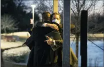  ?? YFFY YOSSIFOR — VIA THE ASSOCIATED PRESS ?? Congregati­on Beth Israel Rabbi Charlie Cytron-Walker, right, hugs a man after a healing service Monday in Southlake, Texas. Cytron-Walker was one of four people held hostage by a gunman at his Colleyvill­e synagogue on Saturday.