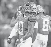  ?? BEN LONERGAN/THE REGISTER-GUARD ?? Defensive back Tysheem Johnson celebrates a stop against Oregon State.