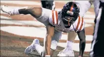  ?? AP ?? BOW WOW! Elijah Moore’s dog-urination celebratio­n led to a 15-yard penalty on the extra point, which Mississipp­i missed with 4 seconds to play in a 21-20 loss.