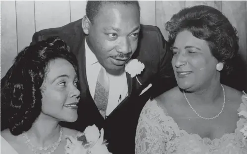  ?? Associated Press ?? above
In this Aug. 9, 1965, file photo, Dr. Martin Luther King, Jr., president of the Southern Christian Leadership Conference, chats with his wife, Coretta, left, and civil rights champion Constance Baker Motley before the start of an S.C.L.C. banquet in Birmingham, Ala.