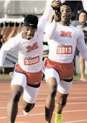  ?? Jerry Baker / For the Chronicle ?? Manvel sophomore Jarren Colbert, left, takes the baton from junior teammate D’Eriq King during the Class 6A boys 4x100-meter relay at the UIL Track & Field State Championsh­ips at Mike A. Meyers Stadium in Austin last weekend.