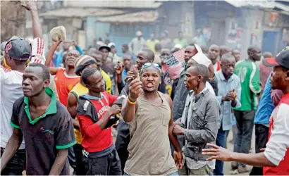  ?? AP ?? A protester holds up the spent casing of a bullet fired by police during a lull in clashes in the Mathare area of Nairobi on Saturday. —