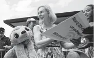  ?? John Locher / Associated Press ?? Sen. Kirsten Gillibrand of New York meets with people at the Iowa State Fair in Des Moines.