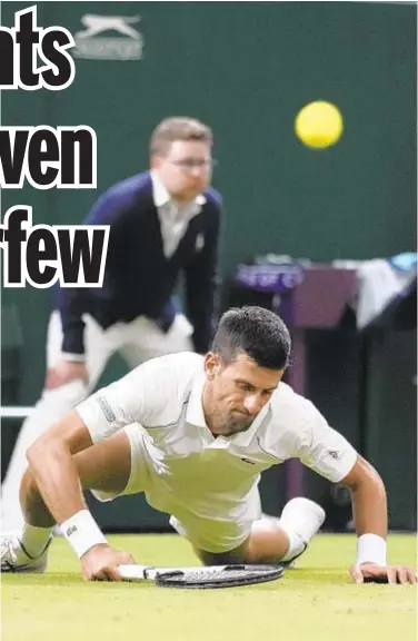  ?? AP ?? Novak Djokovic falls while attempting to return ball to Tim van Rijthoven in fourth-round match Sunday.