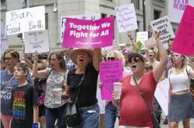  ?? Emily Matthews/Post-Gazette ?? Abortion rights supporters march down Fifth Avenue during Pittsburgh’s Bans Off Our Bodies rally on May 14.