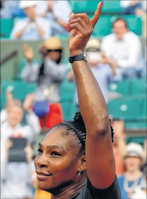  ?? AP PHOTO ?? Serena Williams celebrates after defeating Kristyna Pliskova in their first round match of the French Open tennis tournament at the Roland Garros stadium on Tuesday in Paris.