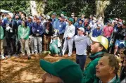  ??  ?? Rory McIlroy hits out of the woods on the first hole on Sunday. “I think when you’re playing in the final group of a major, there’s always going to be pressure,” he said.