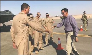  ?? The Associated Press ?? HOTSPOTS: Defense Secretary Mark Esper talks with U.S. troops in front of an F-22 fighter jet deployed to Prince Sultan Air Base in Saudi Arabia on Tuesday.