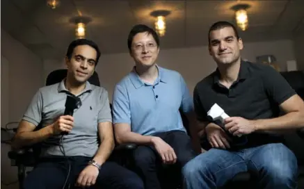  ?? MATHEW MCCARTHY, RECORD STAFF ?? Iman Khodadad, left, Alexander Wong, and Farnoud Kazemzadeh. They have developed a hand-held scanner for early detection of skin cancer.