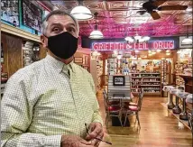  ??  ?? Pharmacist Ric Griffith, who was elected to the House of Delegates last year, has been vaccinatin­g customers at Griffith & Feil Drug in Kenova, W.VA. “They’re your friends and neighbors,” Griffith says.