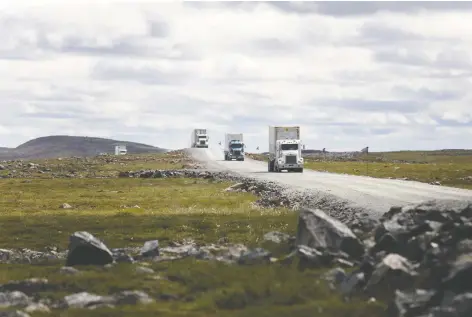  ?? COLE BURSTON/BLOOMBERG FILES ?? Trucks drive along a road near Agnico’s Meadowbank gold complex in Nunavut in July. Agnico CEO Sean Boyd says Canada needs a better conversati­on about how its resources can be tapped to create value for everyone.