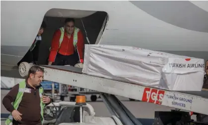  ?? ?? The coffin containing the body of Christian Atsu is loaded into an airplane bound for Ghana. Photograph: Can Erok/AFP/Getty Images