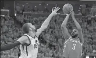  ?? The Associated Press ?? MID-RANGE: Houston guard Chris Paul (3) shoots over Utah Jazz center Rudy Gobert (27) Sunday in the first half of the Rockets’ 100-87 win in Salt Lake City to take a 3-1 lead in the second round of the NBA playoffs.