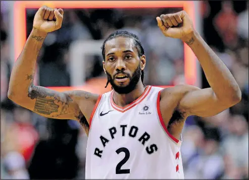  ?? —CP ?? Kawhi Leonard celebrates the Raptors’ harrowing win over the Atlanta Hawks at Scotiabank Arena on Tuesday night. It was only the 22nd time in 43 games that all-stars Leonard and Kyle Lowry have suited up together.
