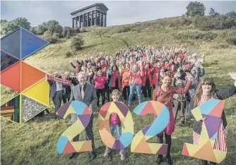  ??  ?? Organisers and supporters promote Sunderland’s bid beneath Penshaw Monument.