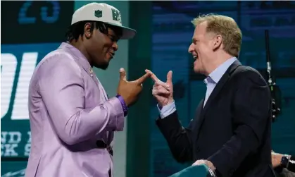  ?? ?? Jalen Carter greets NFL commission­er Roger Goodell after being chosen by the Philadelph­ia Eagles. Photograph: Jeff Roberson/AP