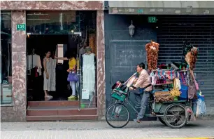  ?? — AFP ?? Retail sales rose 10.7 per cent in April from a year earlier, weaker than March’s 10.9 per cent gain.