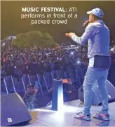  ?? ?? MUSIC FESTIVAL: ATI performs in front of a packed crowd