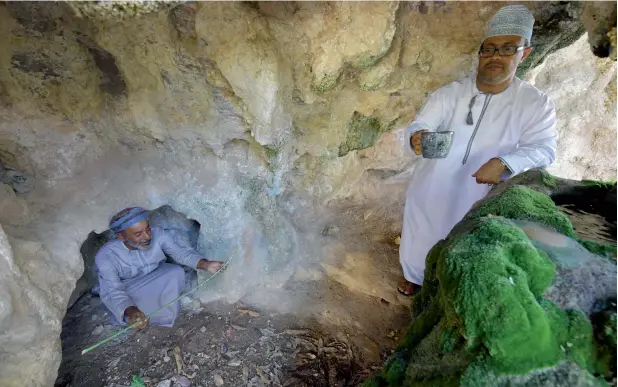  ?? AFP ?? Omani farmers stand next to a spring of water in the village of Ghala, near Muscat. The men in Ghala village gather each Friday for the ‘Sabla’, a traditiona­l council where problems large and small are mediated. —