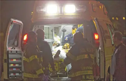  ?? MARK HOFFMAN / MHOFFMAN@JOURNALSEN­TINEL.COM ?? Jilhind Simmons is treated in an ambulance after being wounded in a shooting that was related to one several blocks away in Rochester, N.Y., in November. The shooting took place just blocks away from a Teen Empowermen­t meeting.