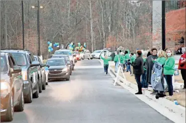  ?? Georgia Northweste­rn Technical College ?? GNTC faculty and staff lined up in front of the Whitfield Murray Campus in Dalton to cheer on the college’s fall graduates. Approximat­ely 80 students graduated during GNTC’S fall drive-thru commenceme­nt ceremony on Thursday, Dec. 3.