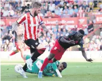  ??  ?? BEES KNEES David Raya saves at feet of Stoke’s Peter Etebo