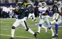 ?? MICHAEL AINSWORTH — THE ASSOCIATED PRESS ?? Eagles running back Jay Ajayi ( 36) leads the Cowboys’ Xavier Woods ( 25) and Byron Jones ( 31) on a long run as Ajayi carries the ball in the second half Sunday in Arlington, Texas.