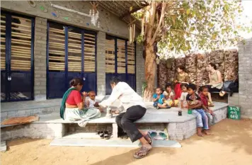  ??  ?? Bholu 11 (the eleventh
anganwadi built by TAP, completed in 2012), with its bright and thermally cool learning environmen­t, has become an oasis within a slum in Ahmedabad.