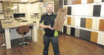  ?? WALTER TYCHNOWICZ, WIRESHARP PHOTOGRAPH­Y ?? It can make sense to keep the old cabinets but reface them with new doors and hardware to get a fresh look for your kitchen or bathroom, says Ken Nicholl.