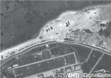  ?? CSIS/AMTI VIA DIGITALGLO­BE ?? Satellite imagery from May 12 shows the deployment of several new weapons systems to China’s base on Woody Island in the Paracels.