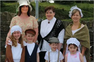  ??  ?? Eilish, Shannon, and Darragh Brosnan, Kay and Billy Keane, and Jessica and Saskia Hughes looking the part at the Ballydesmo­nd 1916 Commemorat­ion Parade