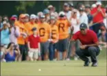  ?? MIKE CARLSON - AP ?? Tiger Woods lines up a putt on the 13th hole during the final round of the Valspar Championsh­ip golf tournament Sunday, March 11, 2018, in Palm Harbor, Fla.