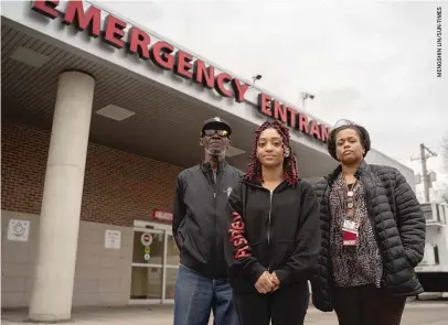  ??  ?? Roseland Community Hospital employees Herman Griffin (from left), Ashley Thornton and Nikia Glenn outside the ER on Wednesday.